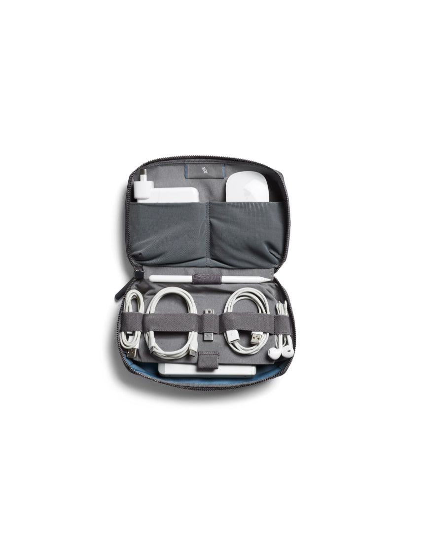 Bellroy Tech Kit in black, compact organizer with multiple compartments for cables, chargers, and electronic accessories.