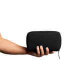 Bellroy Tech Kit in black showing organized compartments for cables, chargers, and tech accessories.
