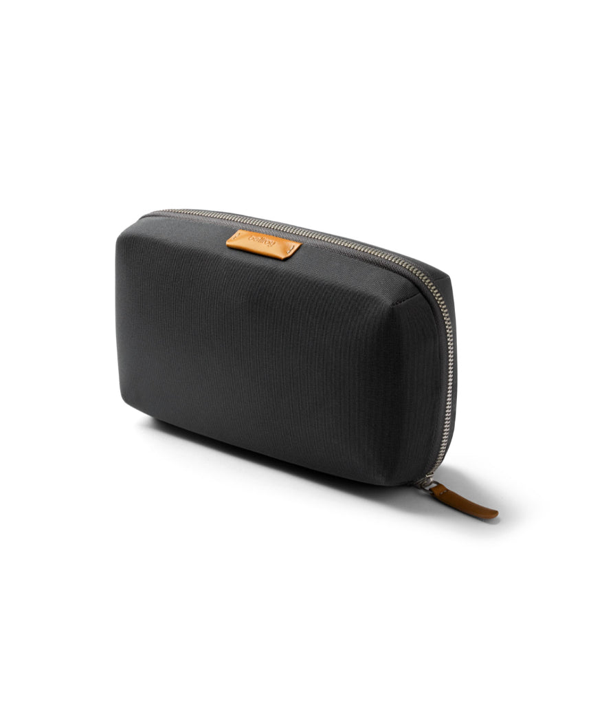 Bellroy Tech Kit in slate color with multiple compartments for accessories and cables, compact and stylish for travel.