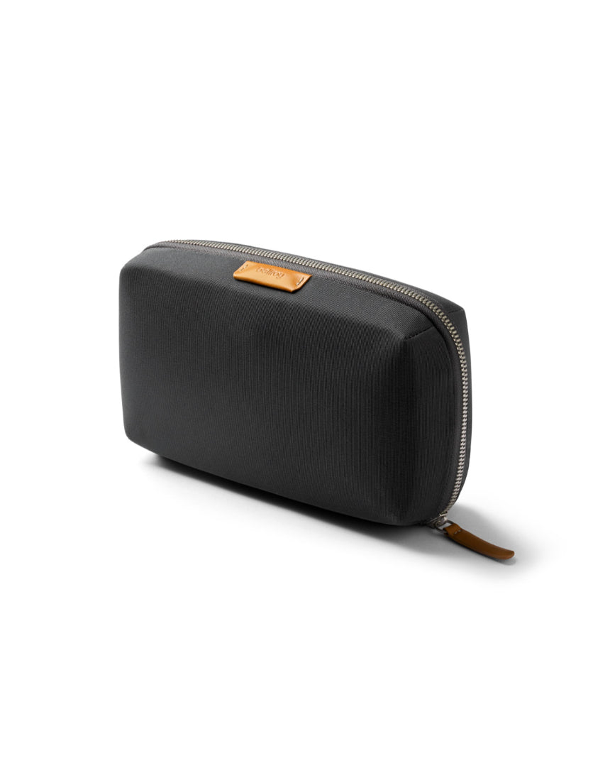 Bellroy Tech Kit in slate color with multiple compartments for accessories and cables, compact and stylish for travel.