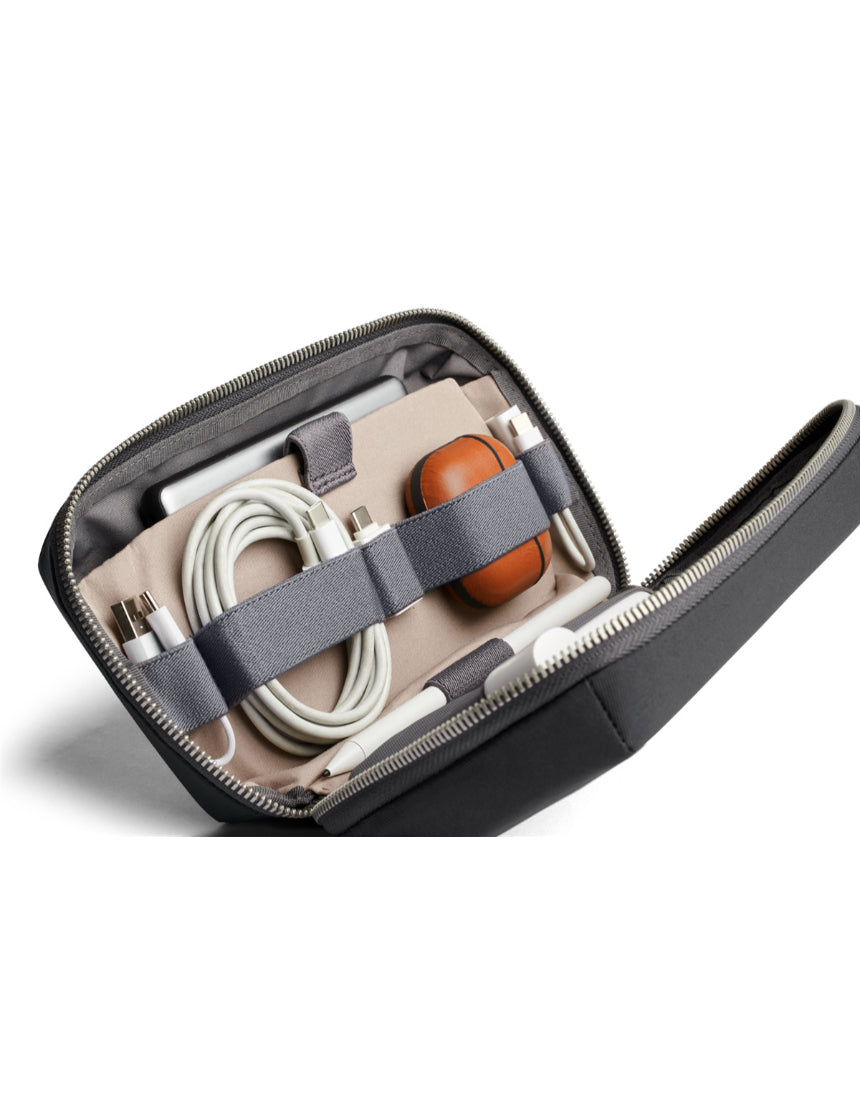 Bellroy Tech Kit in slate color with organized compartments for cables, chargers, and accessories, made from durable material.