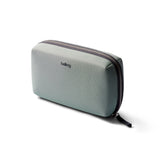 Bellroy Tech Kit in eucalyptus color with multiple compartments for organizing cables and accessories.