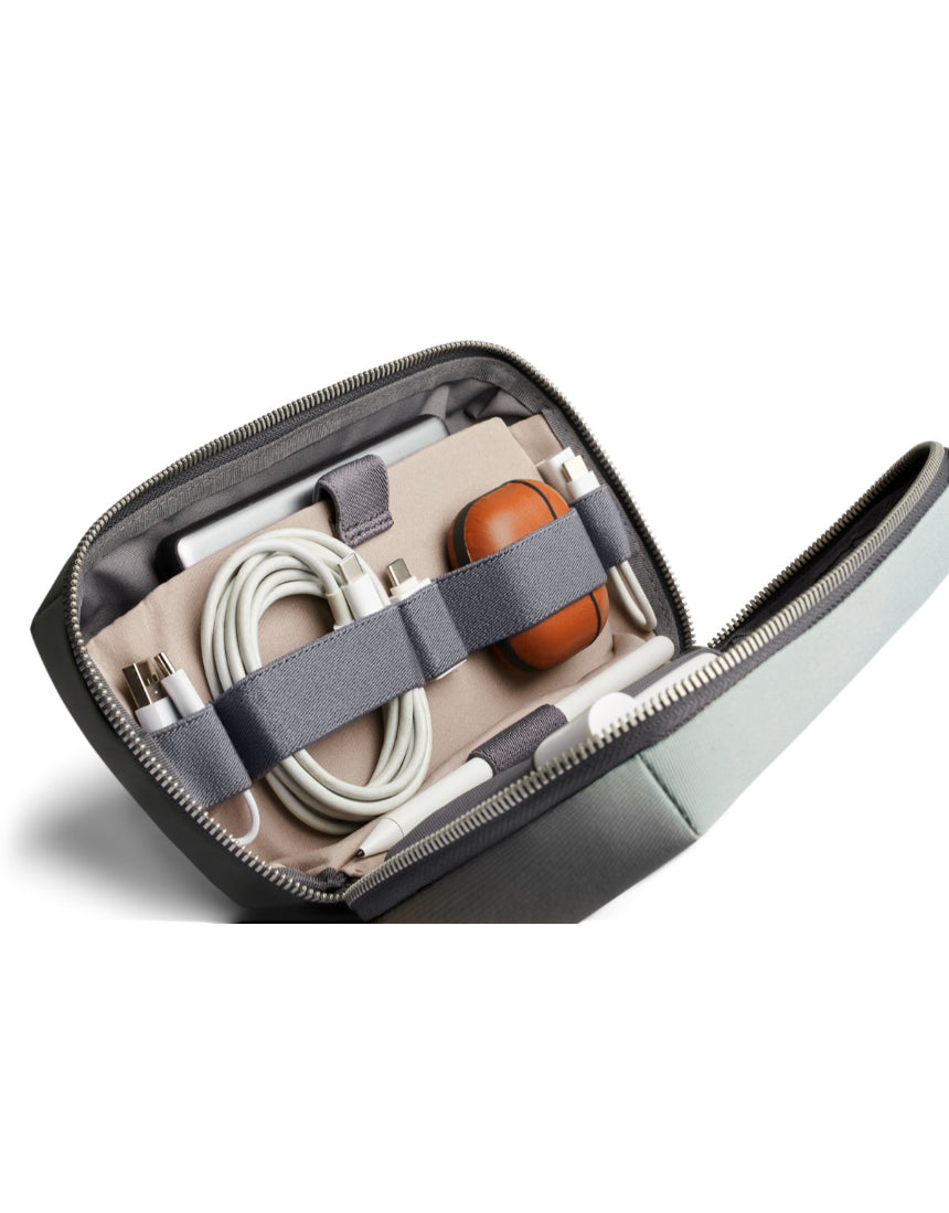 Bellroy Tech Kit in eucalyptus color, compact organizer with multiple compartments for cables, chargers, and tech accessories.