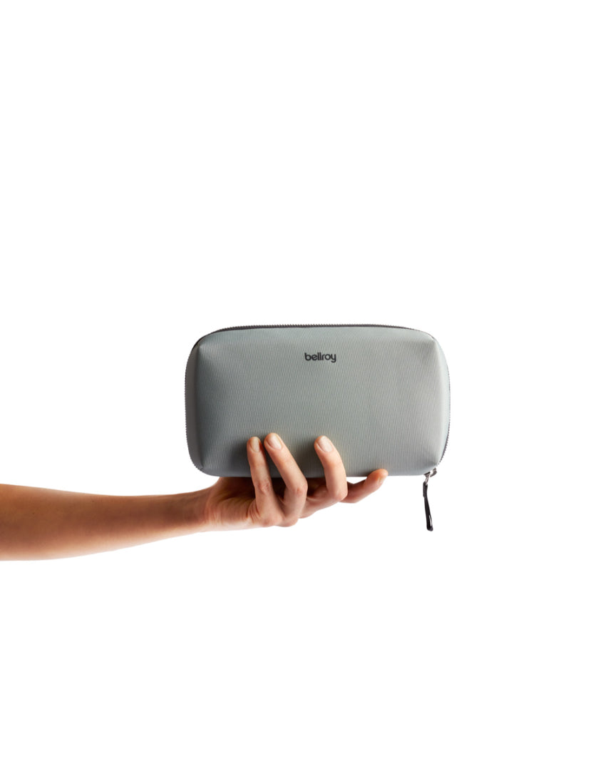 Bellroy Tech Kit in Eucalyptus color, showing compact organizer with multiple compartments for cables and accessories.