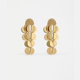 Gold Elk Ozett Drop Earring featuring a sleek, minimalist design with a smooth, elongated drop shape on a delicate hook.