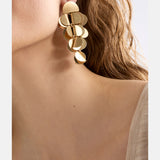 Gold Elk Ozett Drop Earring featuring sleek, modern design with a smooth drop shape and polished finish.
