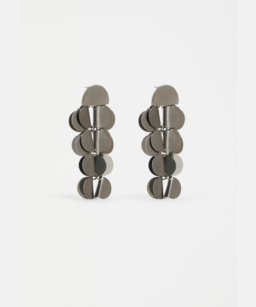 Gunmetal Elk Ozett Drop Earring with sleek, modern design featuring a smooth, elongated drop silhouette and subtle branding.