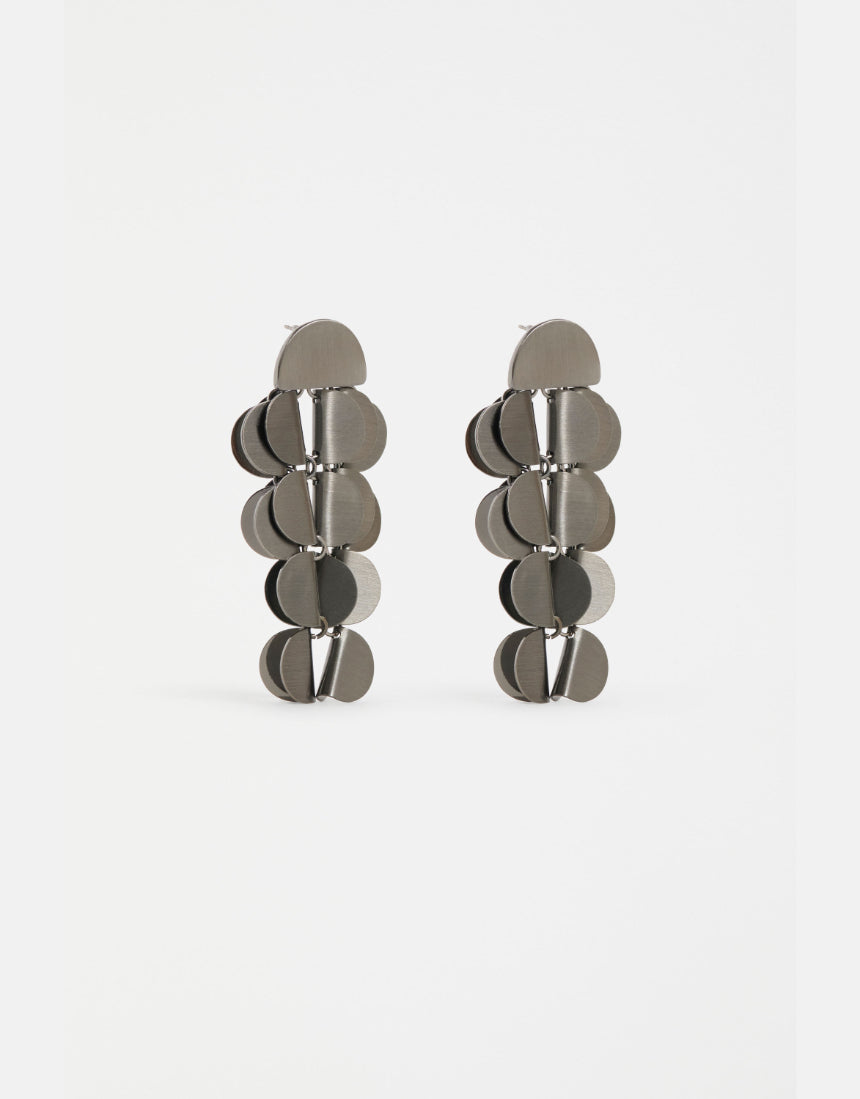 Gunmetal Elk Ozett Drop Earring with sleek, modern design featuring a smooth, elongated drop silhouette and subtle branding.