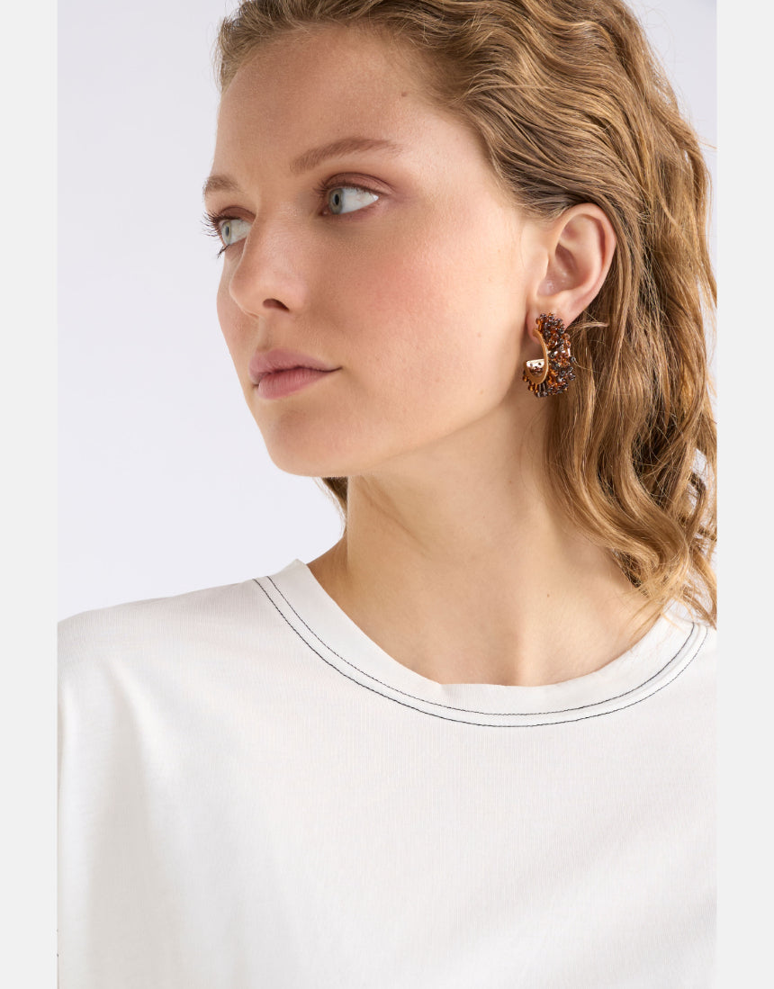 Elk Karan Small Hoop Earring in tortoiseshell with a smooth, rounded hoop design on a white background.