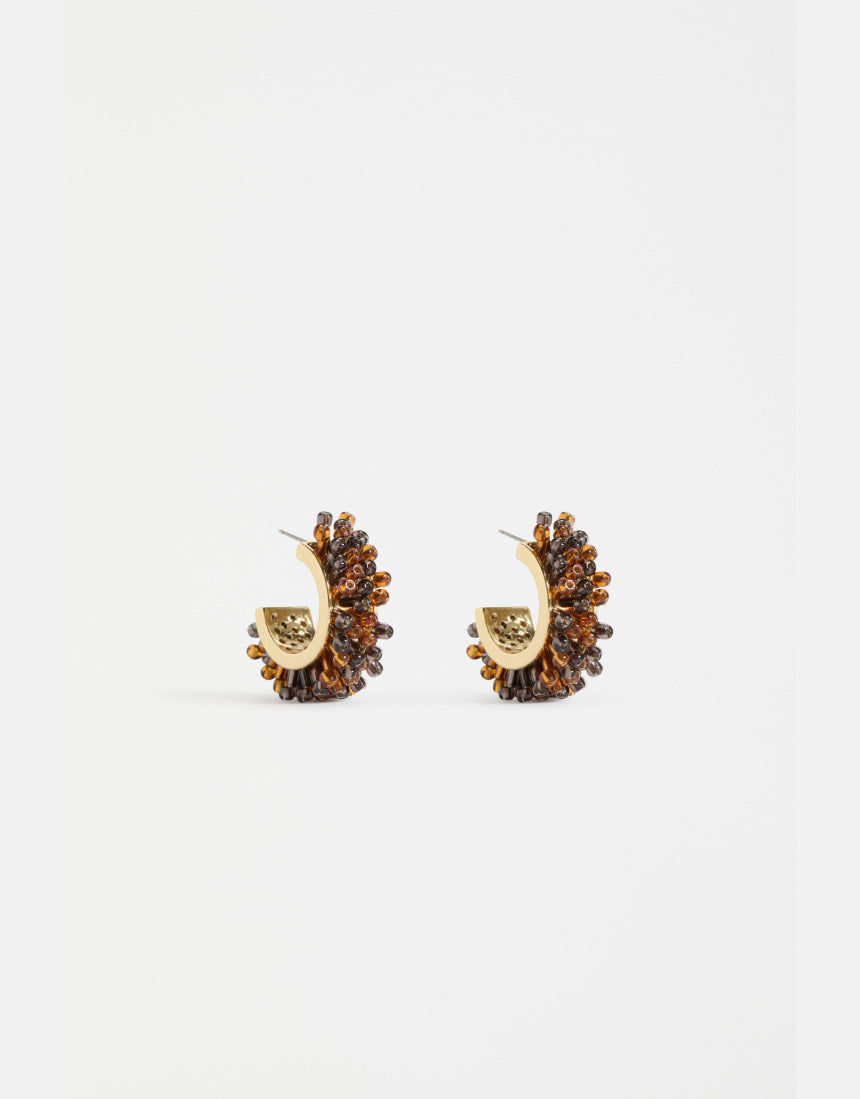 Elk Karan small hoop earrings in tortoiseshell with gold-tone accents, showcasing a stylish and lightweight jewelry design.