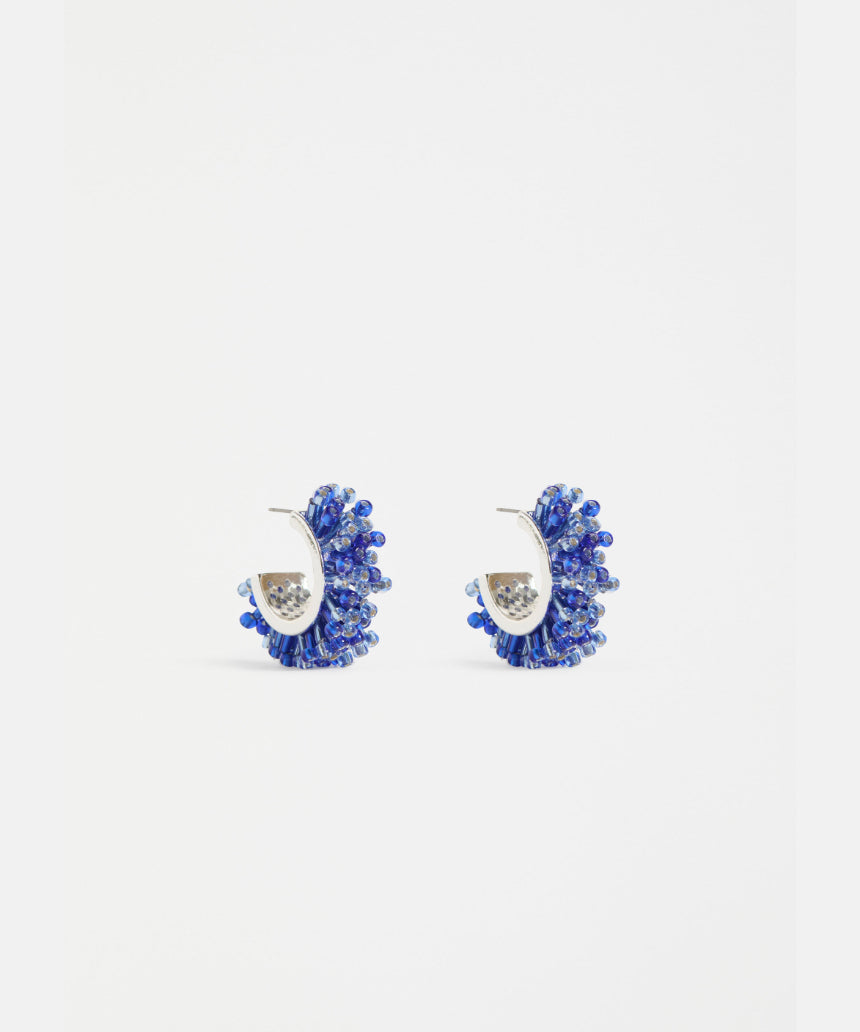 Elk Karan Small Hoop Earring in denim fabric, showcasing a stylish, lightweight hoop design with denim texture.