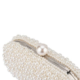 Olga Berg Valentina Pearl Clutch bag with a glossy pearl finish and elegant gold clasp, perfect for evening occasions.