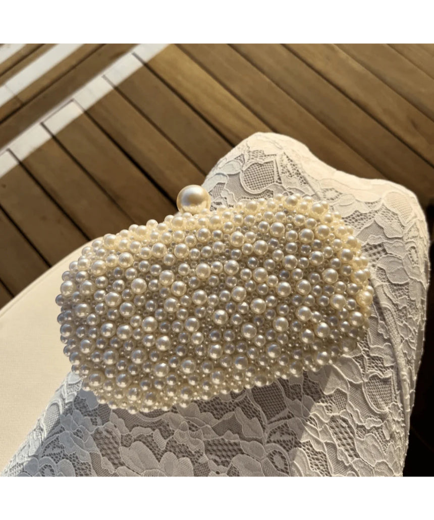 Olga Berg Valentina Pearl Clutch bag with sparkling pearl embellishments and elegant design, perfect for evening events.