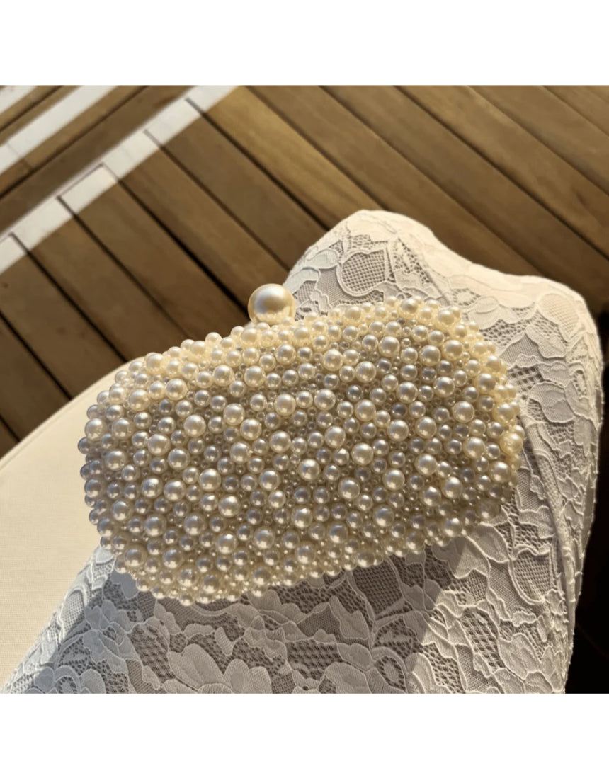 Olga Berg Valentina Pearl Clutch bag with sparkling pearl embellishments and elegant design, perfect for evening events.
