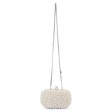 Olga Berg Valentina Pearl Clutch bag with elegant pearl embellishments and a sleek, compact design for evening occasions.