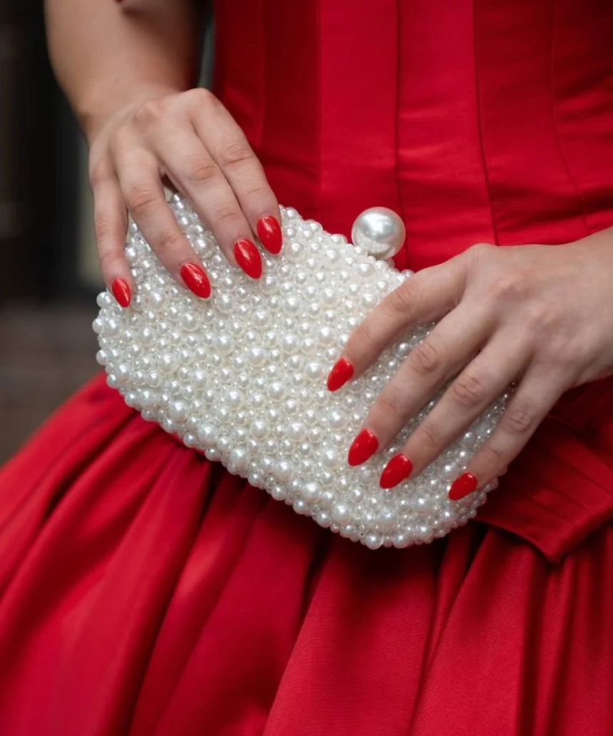 Olga Berg Valentina Pearl Clutch bag with pearl embellishments and sleek design, perfect for elegant occasions.
