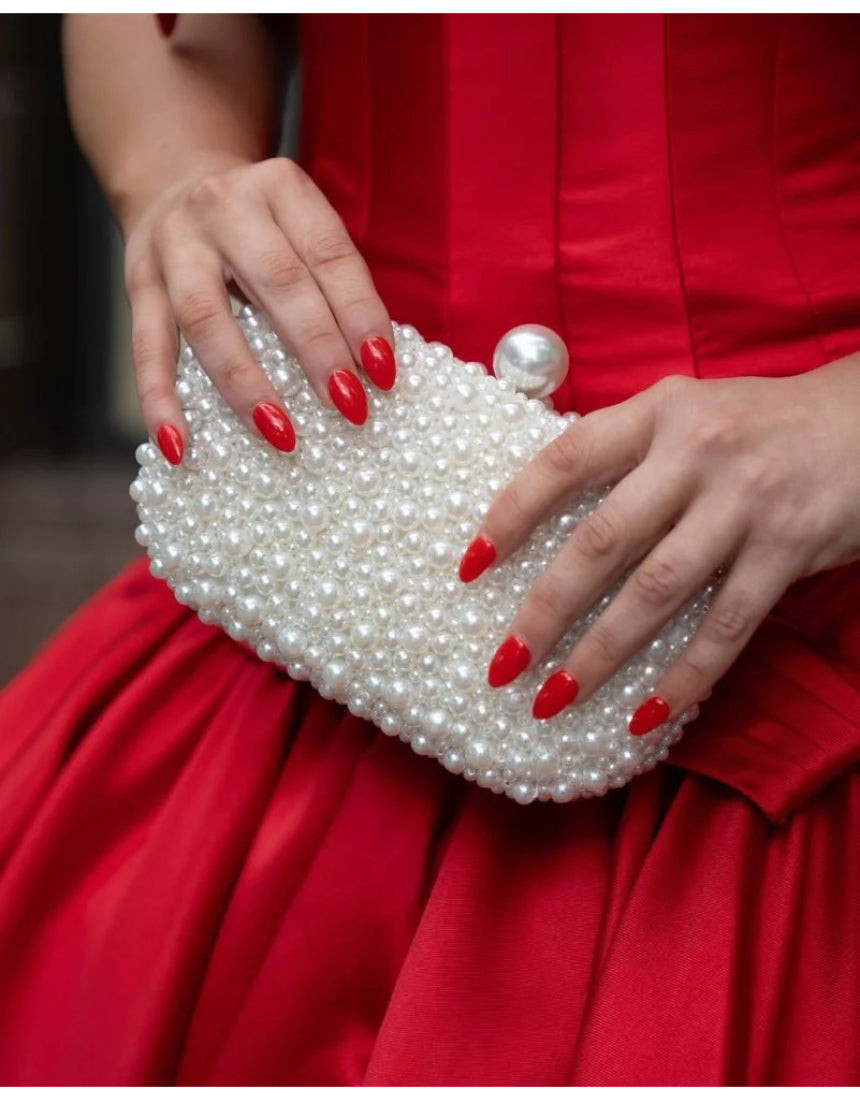 Olga Berg Valentina Pearl Clutch bag with pearl embellishments and sleek design, perfect for elegant occasions.
