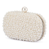Olga Berg Valentina Pearl Clutch bag with elegant pearl embellishments and a sleek rectangular design.