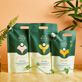 We The Wild Essential Trio plant pack featuring three healthy, vibrant plants in eco-friendly containers.