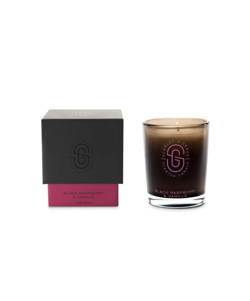 Scarlet & Grace Black Raspberry & Vanilla candle with black and red wax, featuring a simple glass holder and a lit wick.