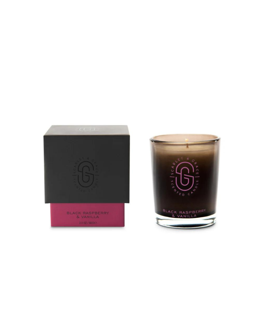 Scarlet & Grace Black Raspberry & Vanilla candle with black and red wax, featuring a simple glass holder and a lit wick.