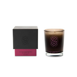 Scarlet & Grace Black Raspberry & Vanilla candle with black and red wax, featuring a simple glass holder and a lit wick.