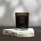 Scarlet & Grace Champagne & Strawberries 60g candle with a decorative wax seal and elegant label on a white background.