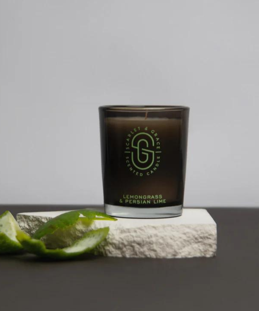 Scarlet & Grace Lemongrass and Persian Lime candle in a 60g jar, shown with fresh green lemongrass and lime slices.