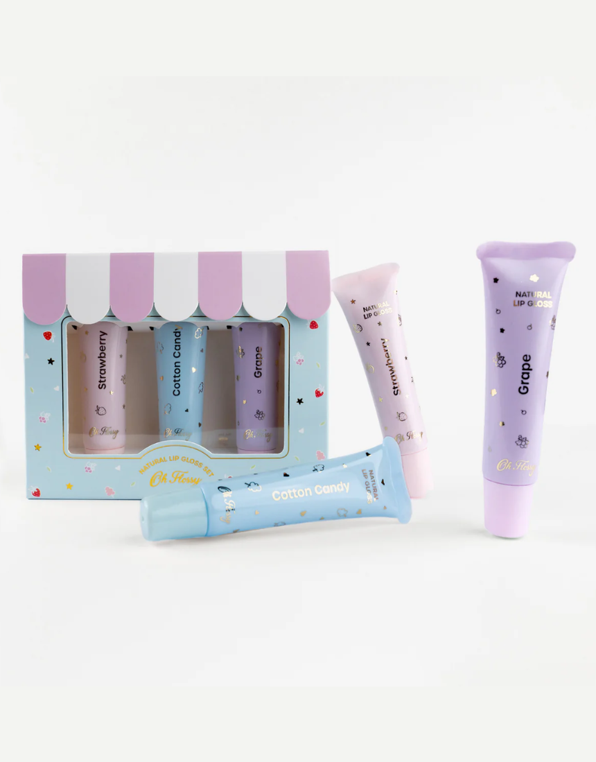 Kids natural lip gloss set by Oh Flossy featuring colorful, shiny lip gloss tubes in bright packaging.