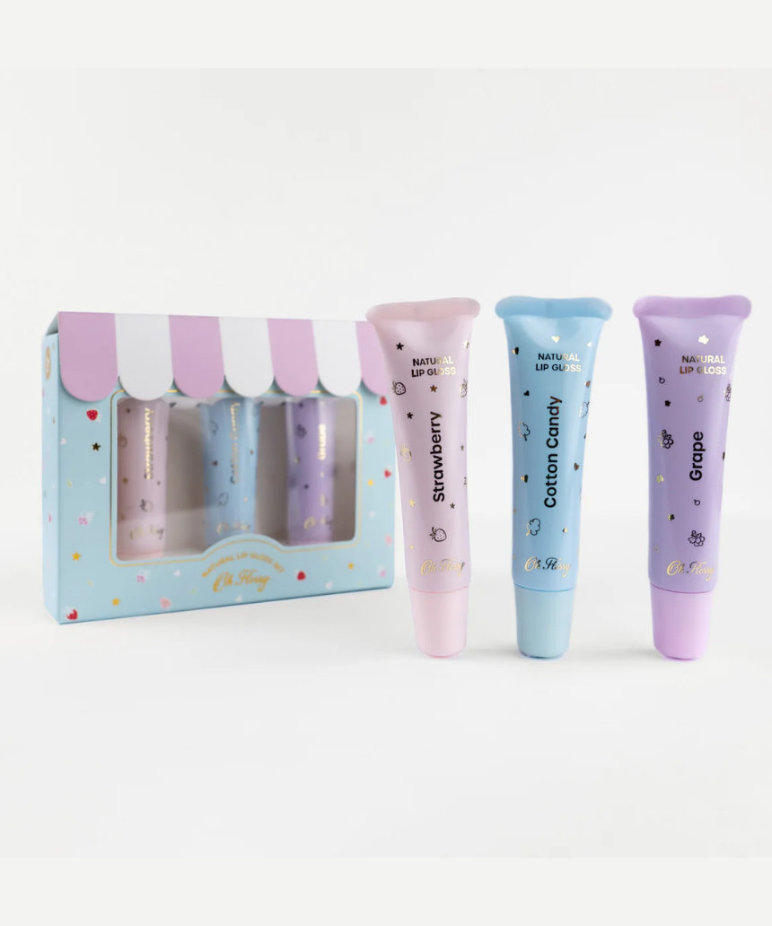 Kids natural lip gloss set by Oh Flossy featuring colorful, glossy lip products in playful packaging for children.