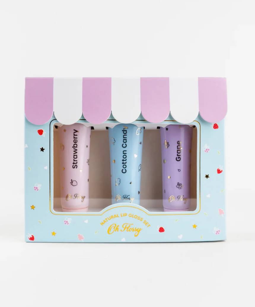 Kids natural lip gloss set by Oh Flossy featuring colorful, shiny lip gloss tubes in playful packaging.