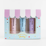 Kids natural lip gloss set by Oh Flossy featuring colorful, shiny lip gloss tubes in playful packaging.