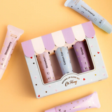 Kids natural lip gloss set by Oh Flossy featuring colorful, kid-friendly lip gloss containers with playful packaging.