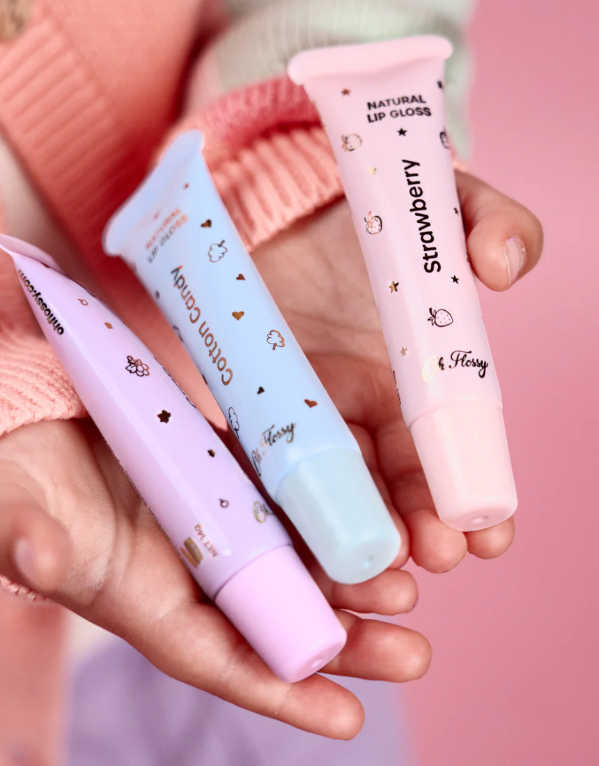 Kids natural lip gloss set by Oh Flossy featuring colorful, shiny lip gloss tubes in playful packaging.