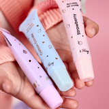 Kids natural lip gloss set by Oh Flossy featuring colorful, shiny lip gloss tubes in playful packaging.