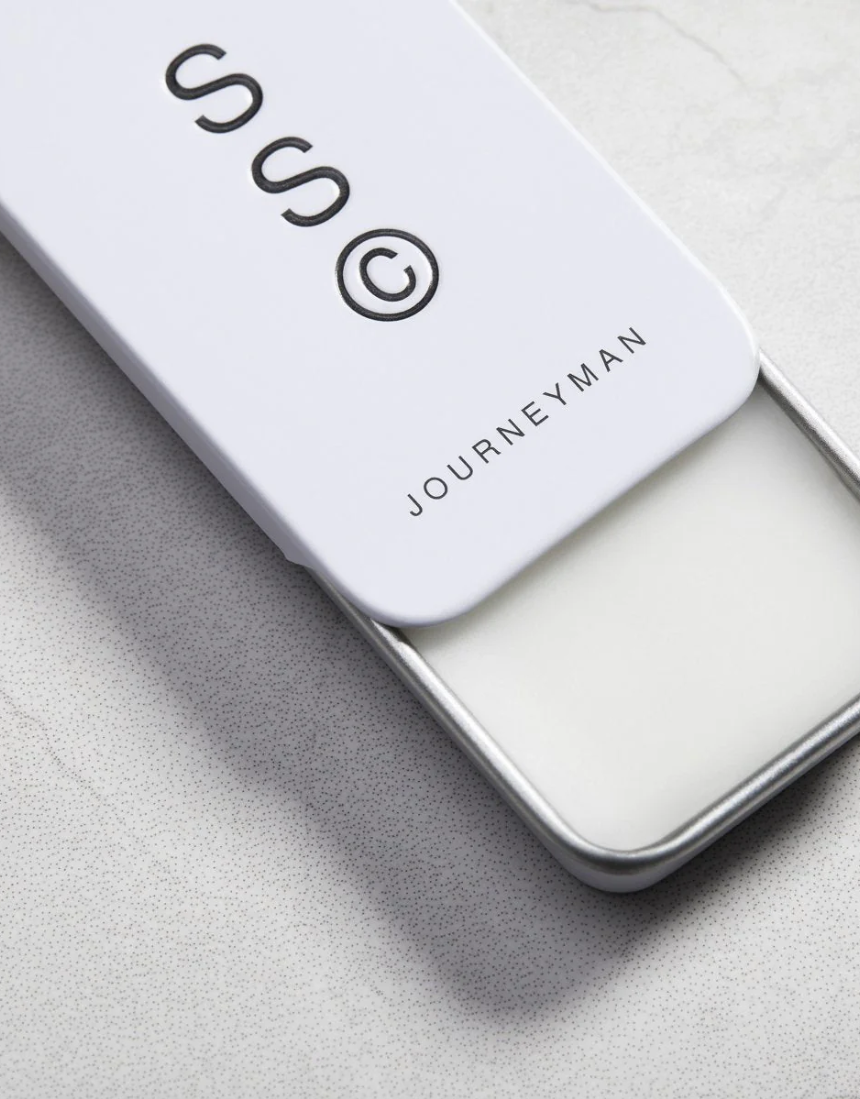Solid State Journeyman solid cologne in a sleek container, showcasing the portable and stylish design of the fragrance.
