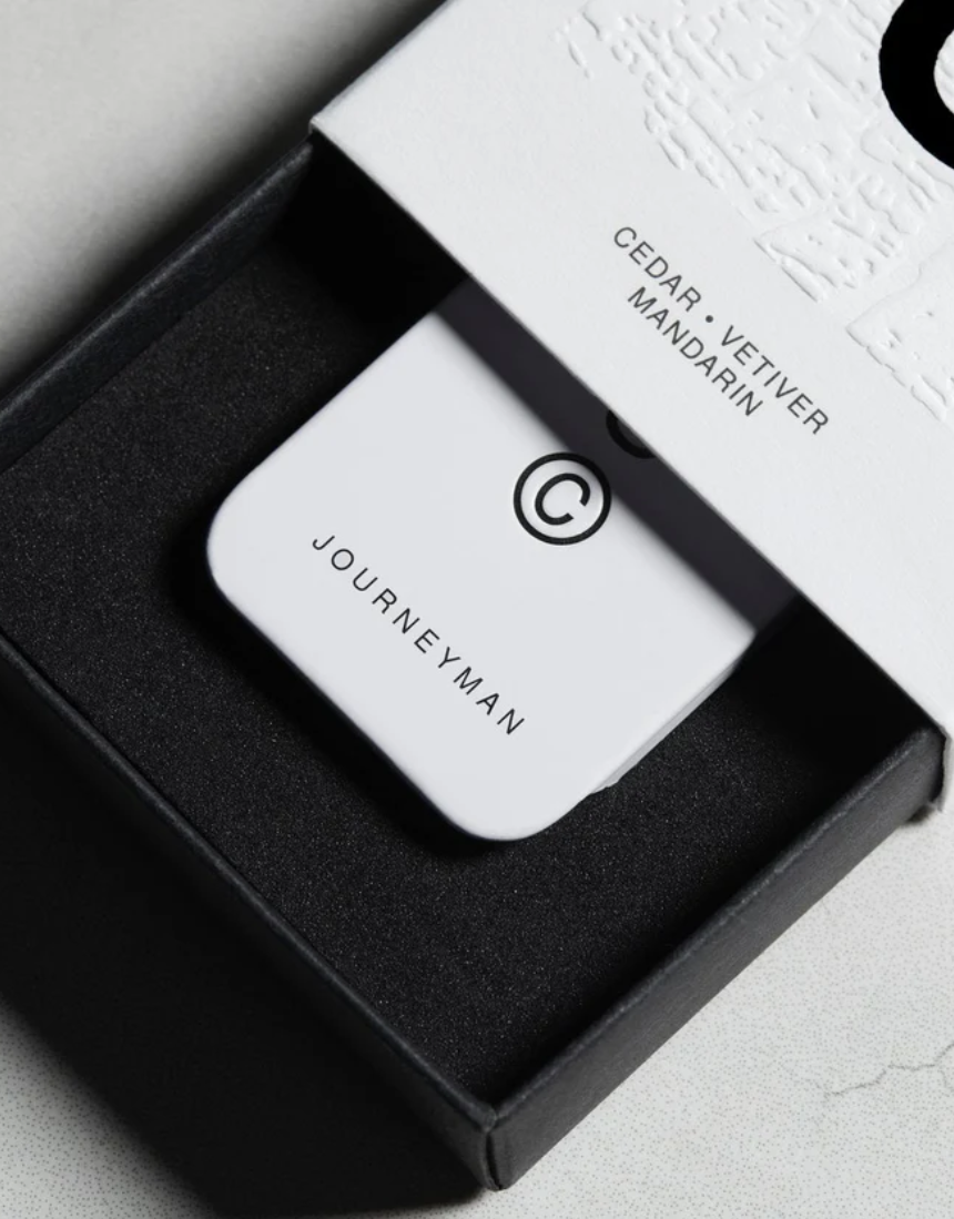 Solid State Journeyman solid cologne bottle with sleek packaging, showcasing its modern design and compact size for on-the-go use.