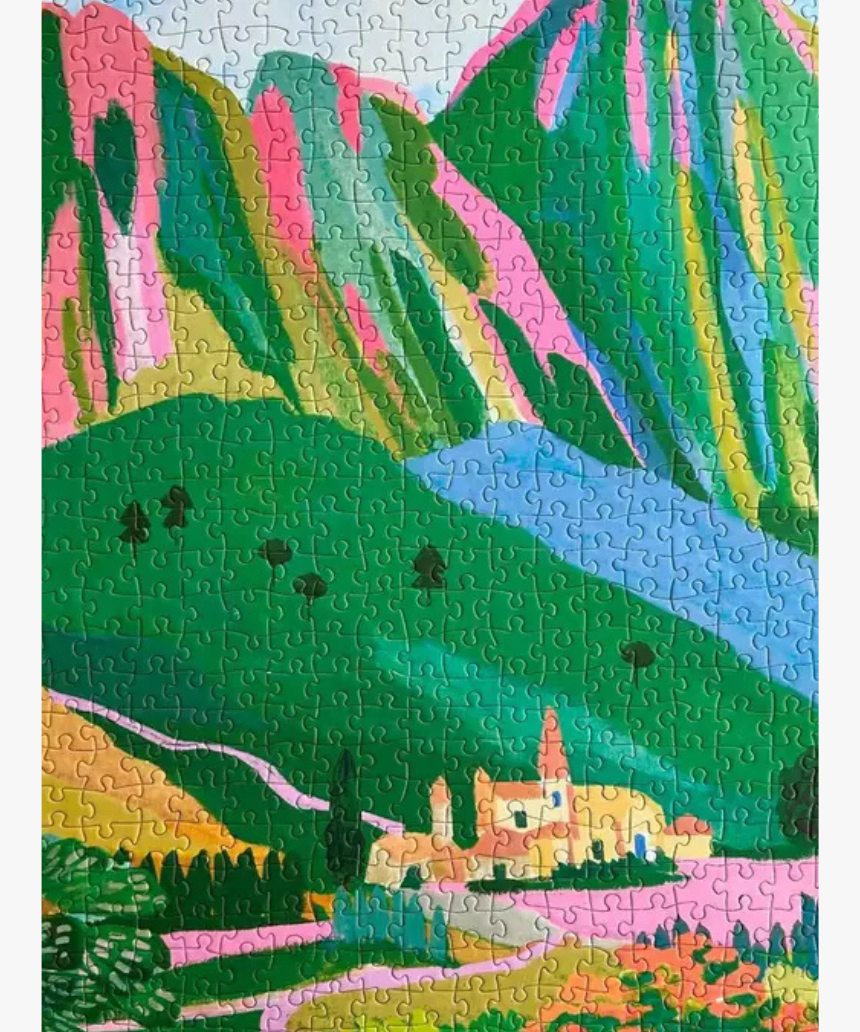 Hebe Studio The Dolomites 1000-piece jigsaw puzzle showing a scenic mountain landscape with colorful peaks and sky.