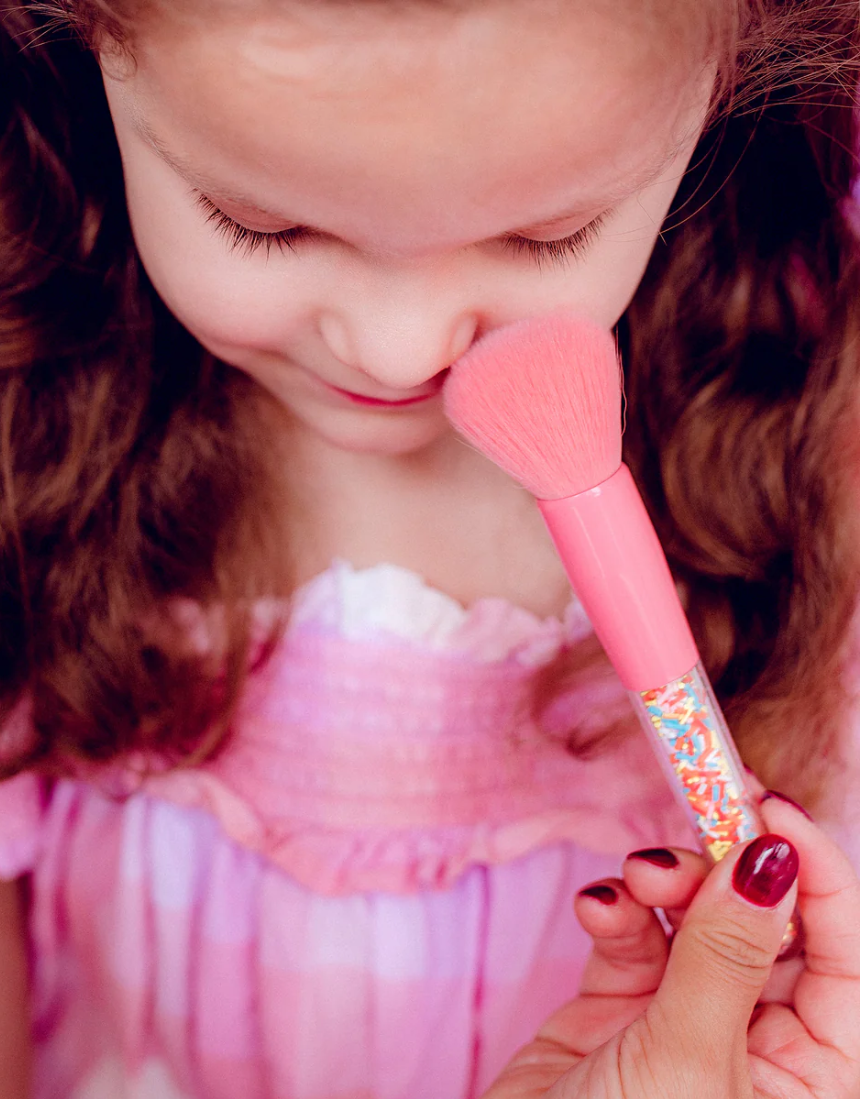 Kids makeup brush set by Oh Flossy featuring colorful, soft brushes with playful sprinkle designs for gentle application.