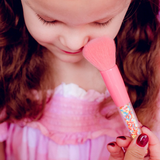 Kids makeup brush set by Oh Flossy featuring colorful, soft brushes with playful sprinkle designs for gentle application.