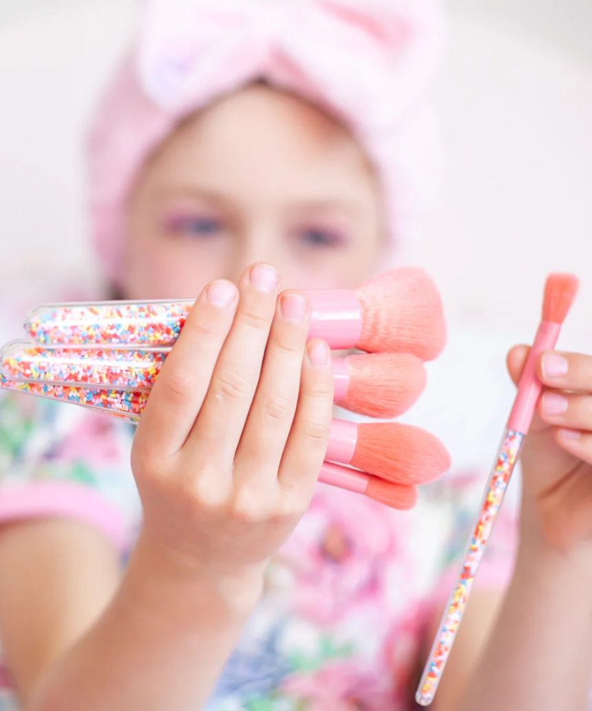 Kids makeup brush set by Oh Flossy featuring colorful, soft brushes with playful sprinkle design for imaginative play.