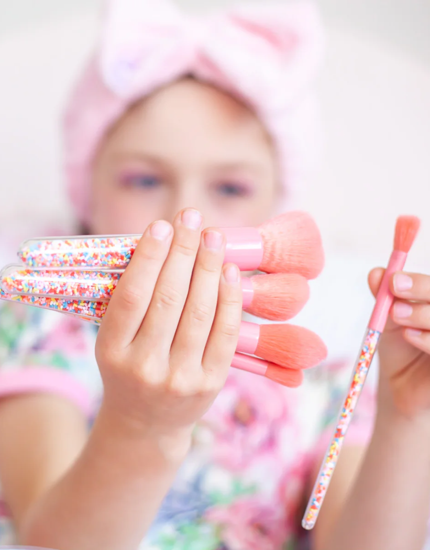 Kids makeup brush set by Oh Flossy featuring colorful, soft brushes with playful sprinkle design for imaginative play.