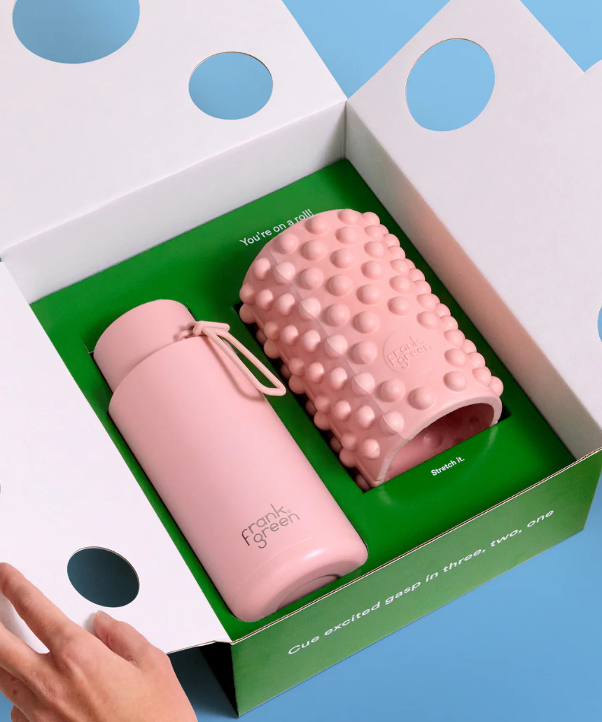 Frank Green Roll With It gift set featuring a blush 34oz/1L drinkwear bottle with matching accessories.