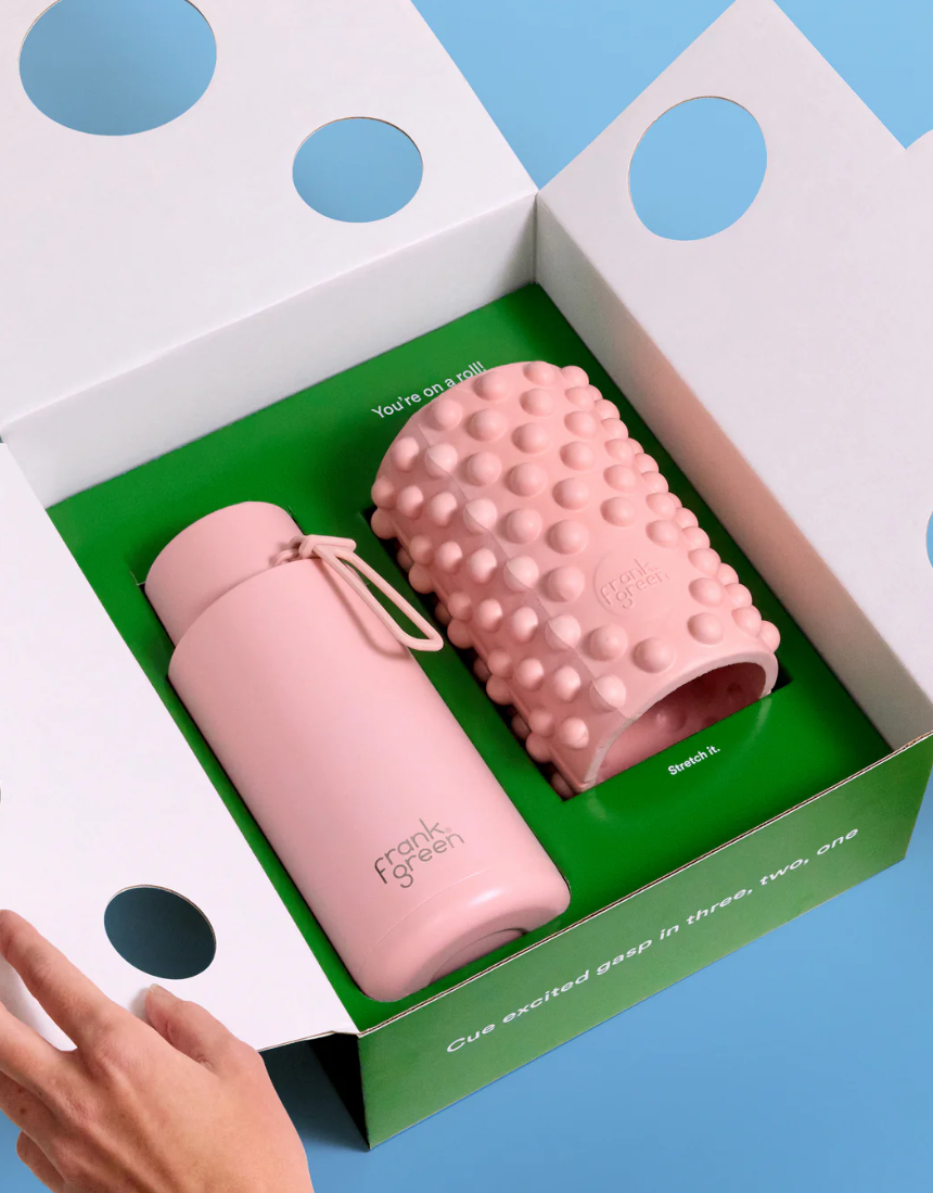 Frank Green Roll With It gift set featuring a blush 34oz/1L drinkwear bottle with matching accessories.