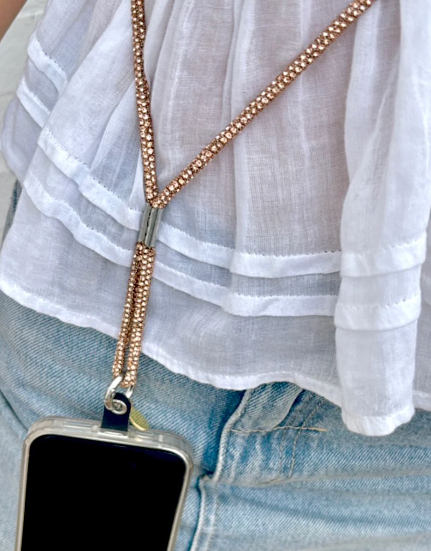 Salty Safari cross body phone strap with diamond-like accents, stylish and functional for carrying phones easily.