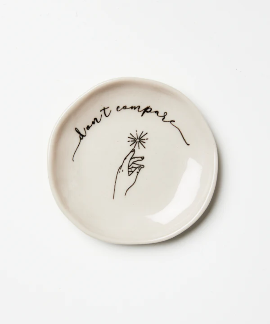 Jones & Co compare dish with a sleek, modern design and minimalist style, featuring a smooth surface and neutral color.