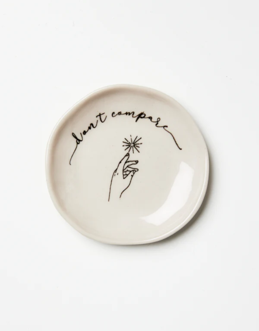 Jones & Co compare dish with a sleek, modern design and minimalist style, featuring a smooth surface and neutral color.
