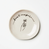 Jones & Co compare dish with a sleek, modern design and minimalist style, featuring a smooth surface and neutral color.