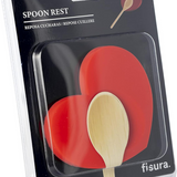 Fisura Heart-shaped spoon rest with a smooth ceramic finish, designed to hold cooking and serving spoons.
