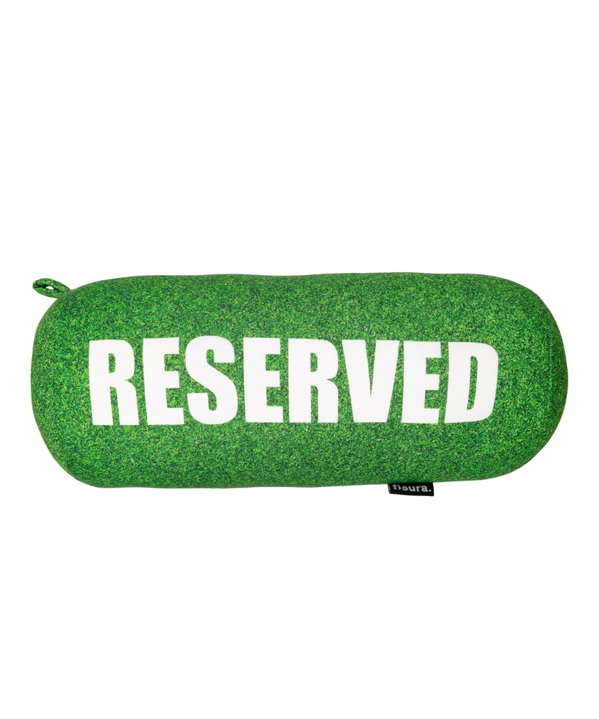 Fisura grass cushion labeled "reserved" with a natural green grassy design, ideal for home decor or outdoor seating.